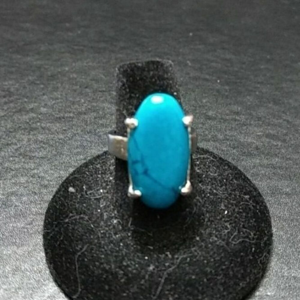 Silver tone ring with blue oval stone size 7